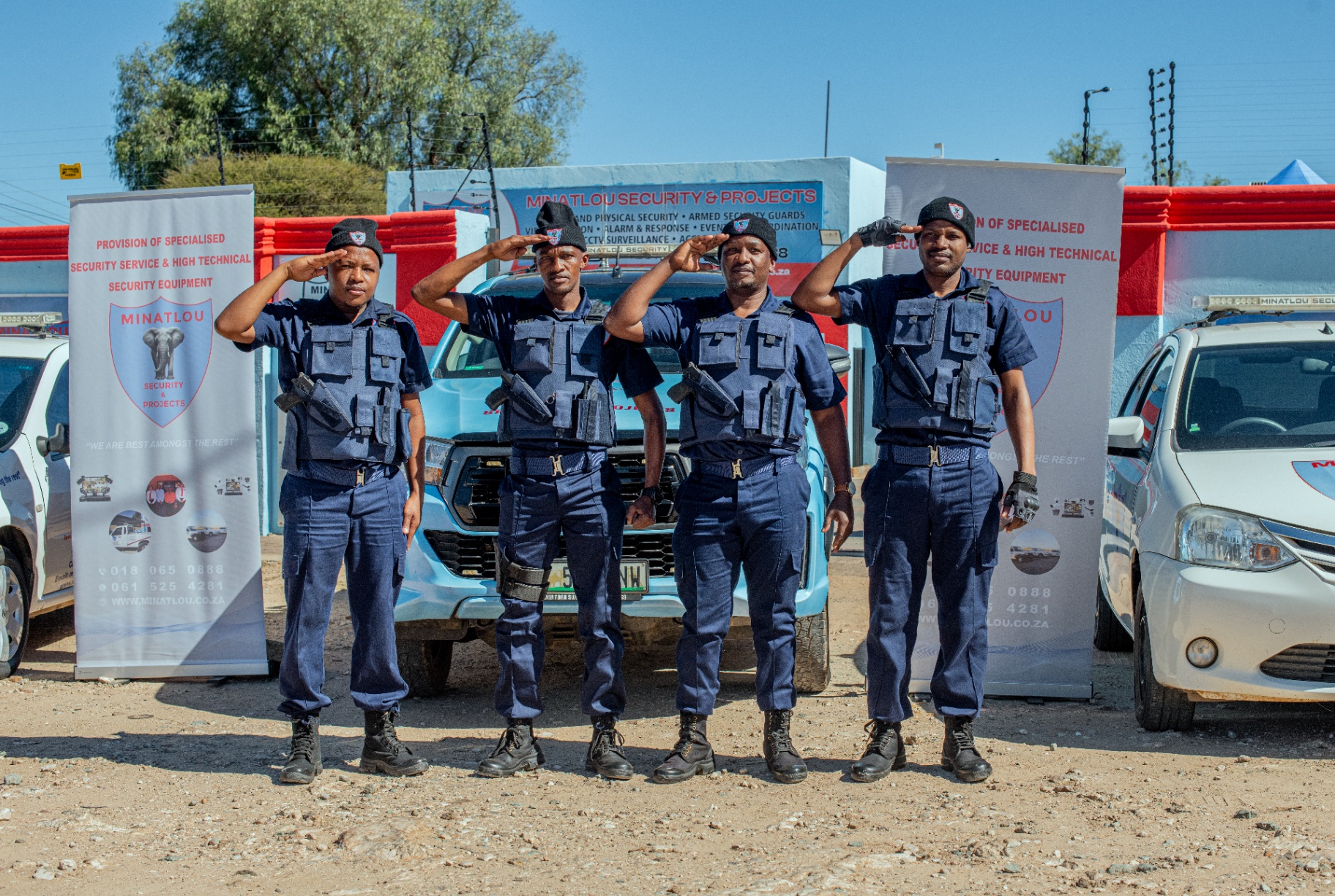 Minatlou Security team lined up in front of company premises and response vehicles